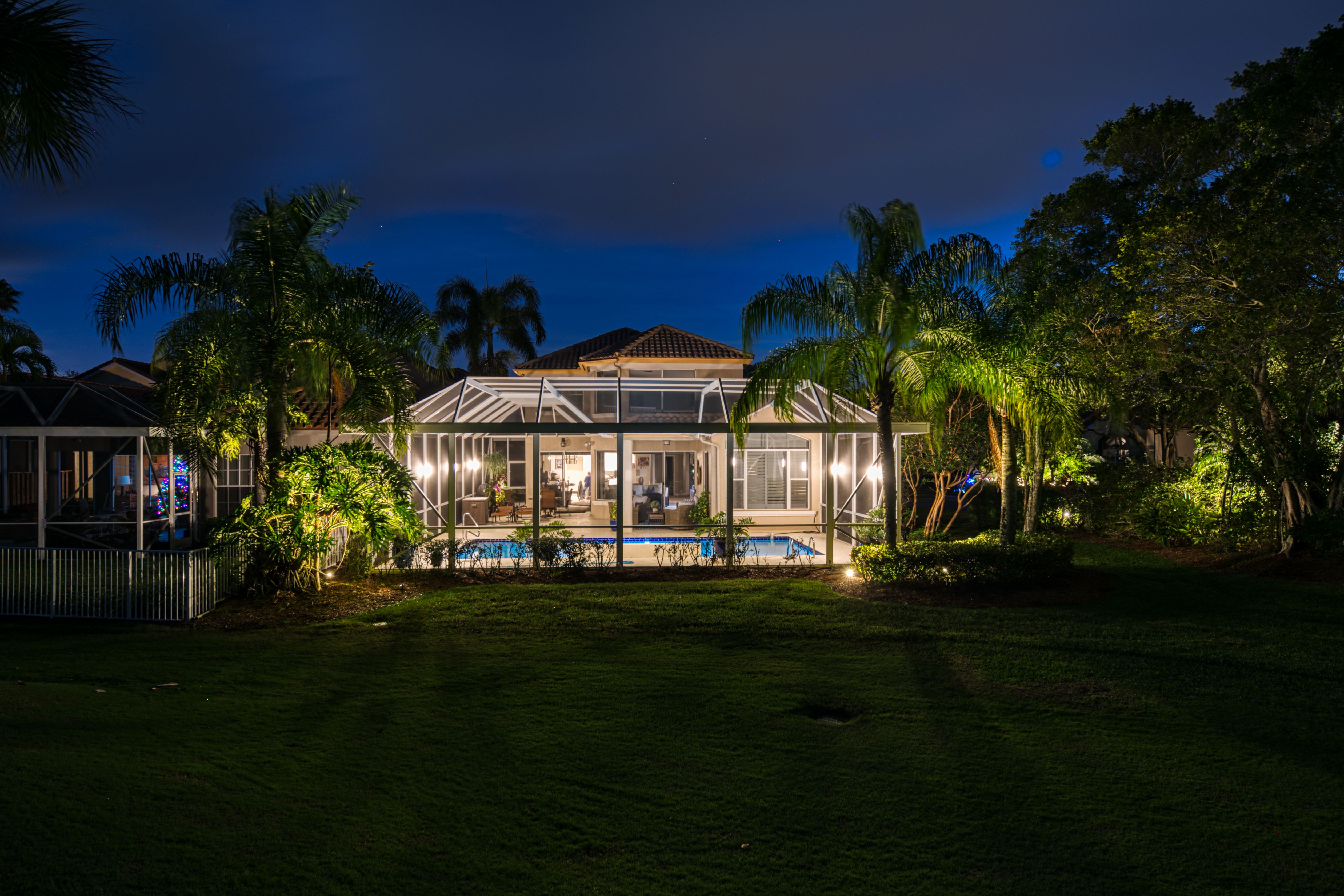 image of a large house at night 